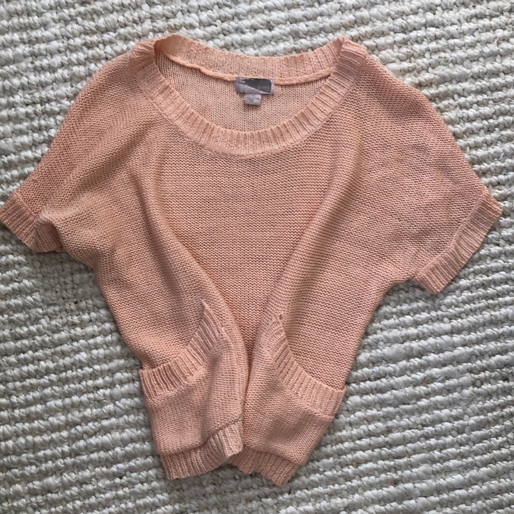 Peach shortsleeved knit top with pockets